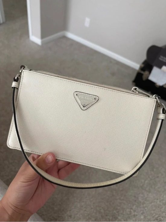 Prada Handbags - Prada Cream Saffiano Mini Wristlet